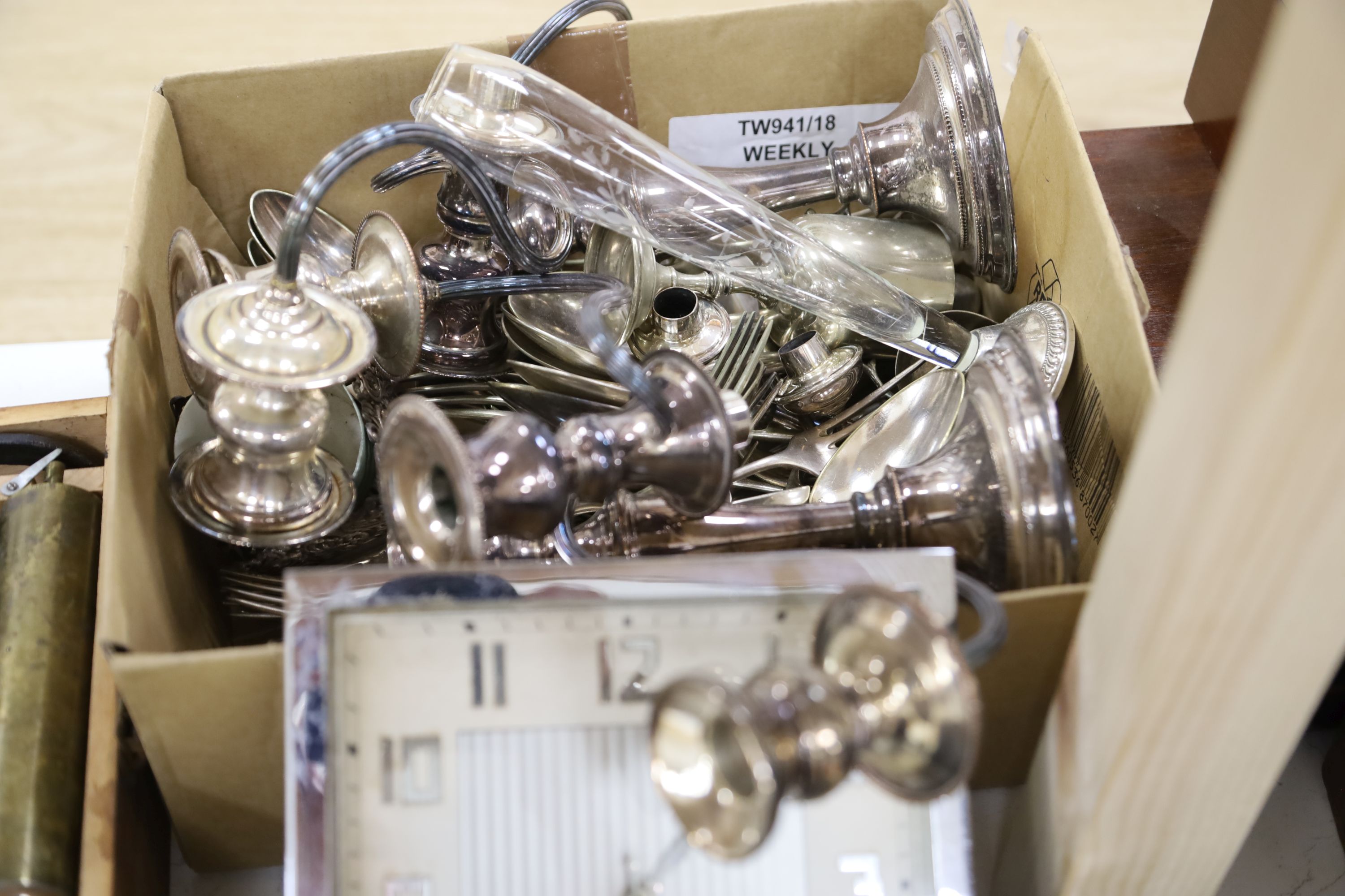 A quantity of silver plated cutlery pair of two branch three light candelabra and tray, Art Deco chrome clock, similar wooden clock, Fr